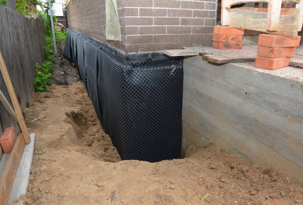 SJ Waterproofing Pros technician performing targeted Waterproofing assessment in Huron, IN